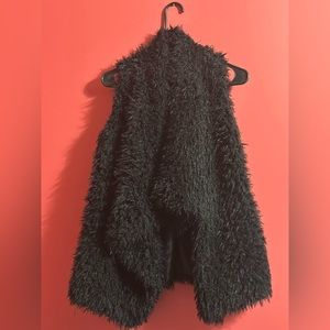 Black sleeveless fur vest